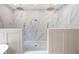 Walk-in shower with dual shower heads and marble tile surround at 113 Stargaze Rdg, Canton, GA 30114