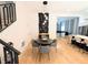Elegant dining area featuring a round table, stylish chairs, hardwood floors, and modern lighting fixtures at 123 Dahlgren St, Atlanta, GA 30317
