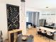 Open concept dining and kitchen area with modern décor, hardwood floors, and contemporary lighting fixtures at 123 Dahlgren St, Atlanta, GA 30317