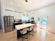 Modern, open kitchen with a large island, stainless steel appliances, and access to an outdoor deck at 123 Dahlgren St, Atlanta, GA 30317