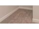 Bedroom corner with plush carpet and clean white trim, offering cozy comfort and elegant detail at 251 Eason St, Bowdon, GA 30108