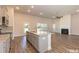 Open concept kitchen featuring a center island, granite countertops, and stainless steel appliances at 251 Eason St, Bowdon, GA 30108