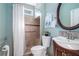 Cozy bathroom with a shower stall, white sink, and decorative painting at 2063 Willow Chase Ct, Tucker, GA 30084