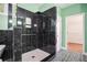 Modern bathroom featuring black marble walk-in shower and patterned tile floors at 2063 Willow Chase Ct, Tucker, GA 30084