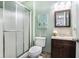Bathroom with a glass door shower, wood-framed mirror, and stylish vanity at 2063 Willow Chase Ct, Tucker, GA 30084