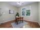Bedroom with hardwood floors, large windows and simple office setup with an area rug at 2063 Willow Chase Ct, Tucker, GA 30084