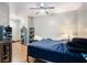 Bedroom with wood floors, ceiling fan, and ample closet space at 2063 Willow Chase Ct, Tucker, GA 30084