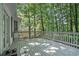 Exterior wooden deck surrounded by lush trees and foliage at 2063 Willow Chase Ct, Tucker, GA 30084