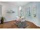 Bright dining area with large windows, modern lighting, and hardwood floors offers a pleasant eating space at 2063 Willow Chase Ct, Tucker, GA 30084