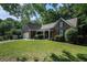 Charming brick home with lush front yard and attached two-car garage in a tree-lined neighborhood at 2063 Willow Chase Ct, Tucker, GA 30084