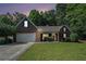 Charming brick home with well-manicured lawn and attached two car garage at 2063 Willow Chase Ct, Tucker, GA 30084
