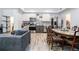 Open living room flowing into kitchen and dining area, featuring modern flooring at 2063 Willow Chase Ct, Tucker, GA 30084