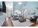 Spacious living room with fireplace, hardwood floors, and plenty of natural light showcasing comfortable home living at 2063 Willow Chase Ct, Tucker, GA 30084