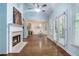 Bright room with fireplace, hardwood floors, vaulted ceiling and large windows for ample natural light at 2063 Willow Chase Ct, Tucker, GA 30084