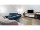 Living room showcasing comfortable seating, stylish rug, and modern entertainment center at 2063 Willow Chase Ct, Tucker, GA 30084
