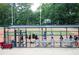 View of the Wills Park ball field and dugout with equipment and players at 2210 Park Walke Dr, Alpharetta, GA 30009