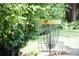 Close view of a disc golf hole surrounded by lush greenery at 2210 Park Walke Dr, Alpharetta, GA 30009