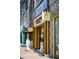Exterior shot of L'Occitane store with bright yellow accents and Kendra Scott sign at 2210 Park Walke Dr, Alpharetta, GA 30009