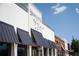 Smokejack restaurant's exterior with gray awnings and classic brick accents at 2210 Park Walke Dr, Alpharetta, GA 30009