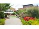 A beautiful community park is shown, with flowers and landscaping near the buildings at 2285 Park Walke Dr, Alpharetta, GA 30009