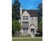 Charming two-story home with elegant brickwork, complemented by lush landscaping, offering a welcoming curb appeal at 2285 Park Walke Dr, Alpharetta, GA 30009