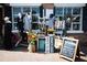 Charming shop front with displays of clothes, pillows, purses, and signage along the sidewalk at 2285 Park Walke Dr, Alpharetta, GA 30009
