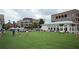 Town green area with restaurants and apartments on the square, people walking and enjoying community life at 2285 Park Walke Dr, Alpharetta, GA 30009