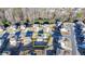 Drone view of a house and surrounding neighborhood, close to a treeline at 4825 Odum View Ln, Cumming, GA 30040