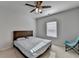 Cozy bedroom featuring neutral walls, ceiling fan, and a comfortable queen-sized bed at 4825 Odum View Ln, Cumming, GA 30040