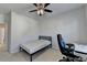 Bedroom with natural light, desk and chair, ceiling fan, and a comfortable twin-sized bed at 4825 Odum View Ln, Cumming, GA 30040