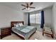 Cozy bedroom featuring a wooden bed frame, dark curtains, and a matching wooden nightstand at 4825 Odum View Ln, Cumming, GA 30040