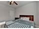 Cozy bedroom features a ceiling fan and comfortable bed, perfect for relaxation at 4825 Odum View Ln, Cumming, GA 30040