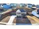 Aerial view showcasing a well-kept two-story home with a brick facade and driveway at 4825 Odum View Ln, Cumming, GA 30040