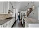 Eat-in kitchen showcases granite countertops, stainless appliances, and an island with bar stool seating at 4825 Odum View Ln, Cumming, GA 30040