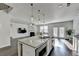 Eat-in kitchen showcases granite countertops, stainless appliances, and an island with bar stool seating at 4825 Odum View Ln, Cumming, GA 30040