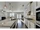 Eat-in kitchen showcases granite countertops, stainless appliances, and an island with bar stool seating at 4825 Odum View Ln, Cumming, GA 30040