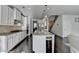 Eat-in kitchen showcases granite countertops, stainless appliances, and an island with bar stool seating at 4825 Odum View Ln, Cumming, GA 30040