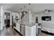 Eat-in kitchen showcases granite countertops, stainless appliances, and an island with bar stool seating at 4825 Odum View Ln, Cumming, GA 30040