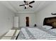 Bright main bedroom featuring tray ceiling, fan, and ensuite access at 4825 Odum View Ln, Cumming, GA 30040