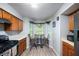 Eat-in kitchen features stainless steel appliances and natural light at 6487 Northridge Way, Morrow, GA 30260