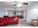 Spacious living room with ceiling fan opens to the dining room and kitchen at 6487 Northridge Way, Morrow, GA 30260