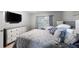 Comfortable main bedroom features a decorative dresser and a view from the window at 6487 Northridge Way, Morrow, GA 30260