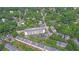 Bird's-eye view of apartments amid green canopy, with adjacent townhomes and tree-lined streets showing community at 840 United Ave # 113, Atlanta, GA 30312