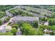 Aerial view of condominium, surrounded by lush trees and well-maintained lawns at 840 United Ave # 113, Atlanta, GA 30312