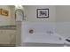 Bathroom with soaking tub with subway tile surround and granite countertop vanity at 840 United Ave # 113, Atlanta, GA 30312
