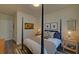 Inviting bedroom featuring a four-poster bed, elegant side tables, and tasteful artwork at 840 United Ave # 113, Atlanta, GA 30312