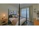 Cozy bedroom with a four-poster bed, stylish decor, and natural light from a window at 840 United Ave # 113, Atlanta, GA 30312