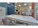 Large game room with communal table, modern lighting, and shuffleboard game at 840 United Ave # 113, Atlanta, GA 30312