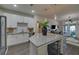 Modern kitchen featuring white cabinets, granite counters, stainless steel appliances, and island with seating at 840 United Ave # 113, Atlanta, GA 30312