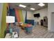 Lounge area with colorful accent wall, modern furnishings, and stainless steel refrigerator at 840 United Ave # 113, Atlanta, GA 30312